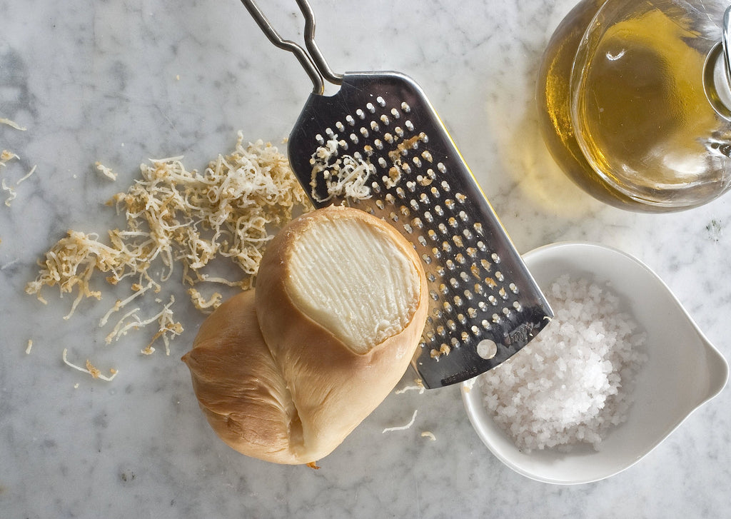 Maplebrook Farm Scamorza Cheese shown grated with salt and olive oil