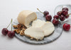 Maplebrook Farms Smoked Mozzarella Cheese sliced with cherries and walnuts
