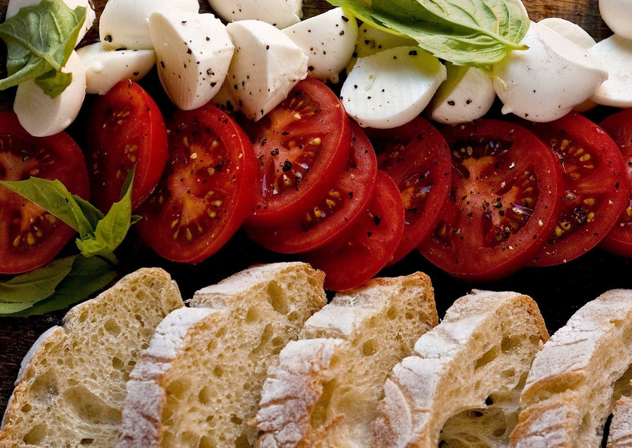 Maplebrook Farm Fresh Mozzarella Cheese with tomatoes and rustic bread displayed